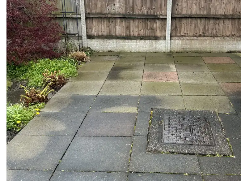 Before: Tired flags to a silver resin yard - S P Groundworks & Driveways
