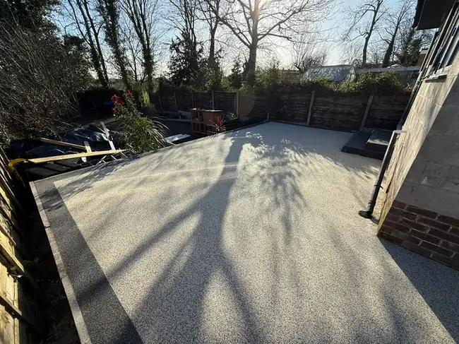 Resin by S P Groundworks & Driveways - Silver resin terrace in a walled garden